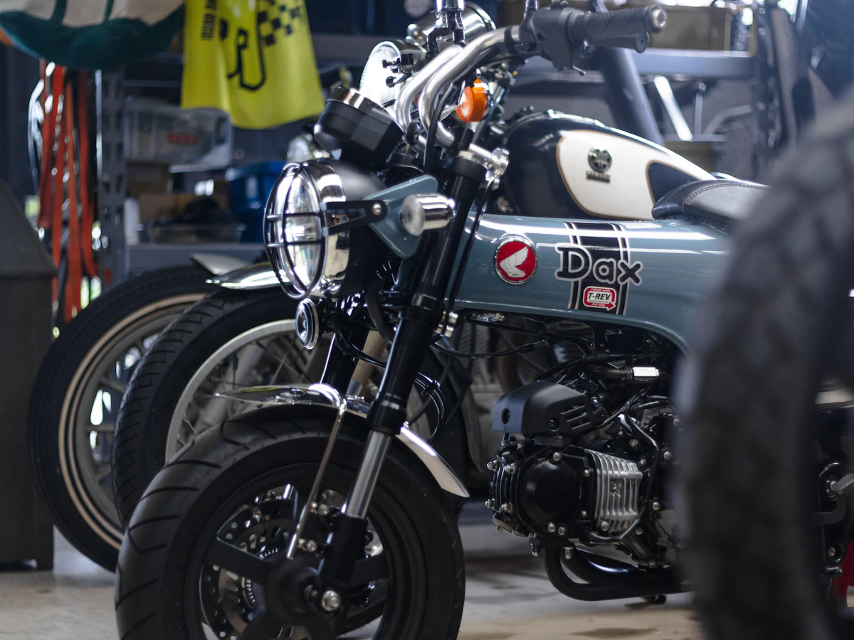 Row of motorcycles arranged inside a clean service garage